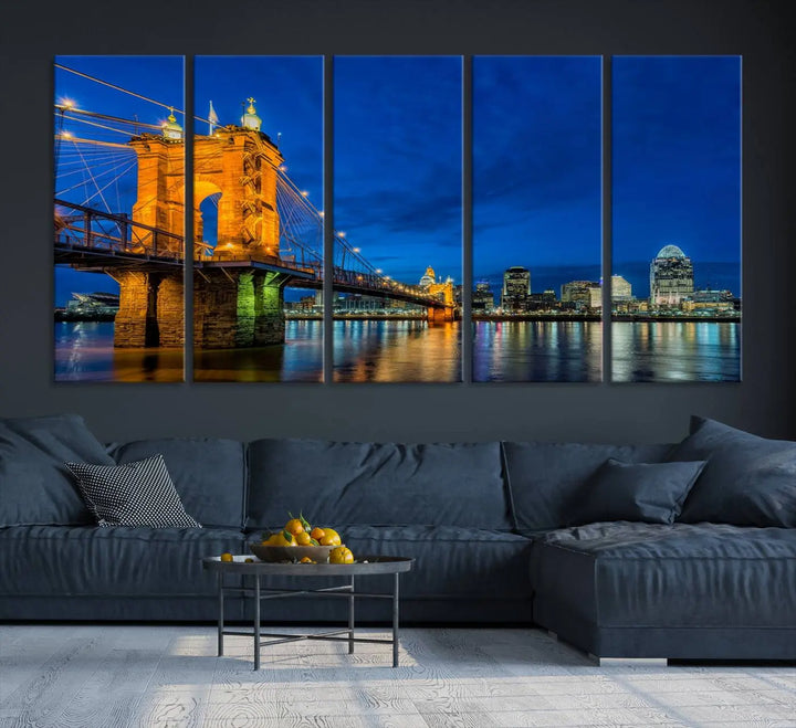 The living room features a museum-quality, multi-panel wall art titled "Cincinnati City Bridge Lights Night Skyline Cityscape View Wall Art Canvas Print," which depicts a lit-up bridge at night. The gallery-wrapped canvas adds a touch of elegance to the space.