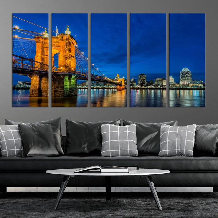 The living room features a museum-quality, multi-panel wall art titled "Cincinnati City Bridge Lights Night Skyline Cityscape View Wall Art Canvas Print," which depicts a lit-up bridge at night. The gallery-wrapped canvas adds a touch of elegance to the space.