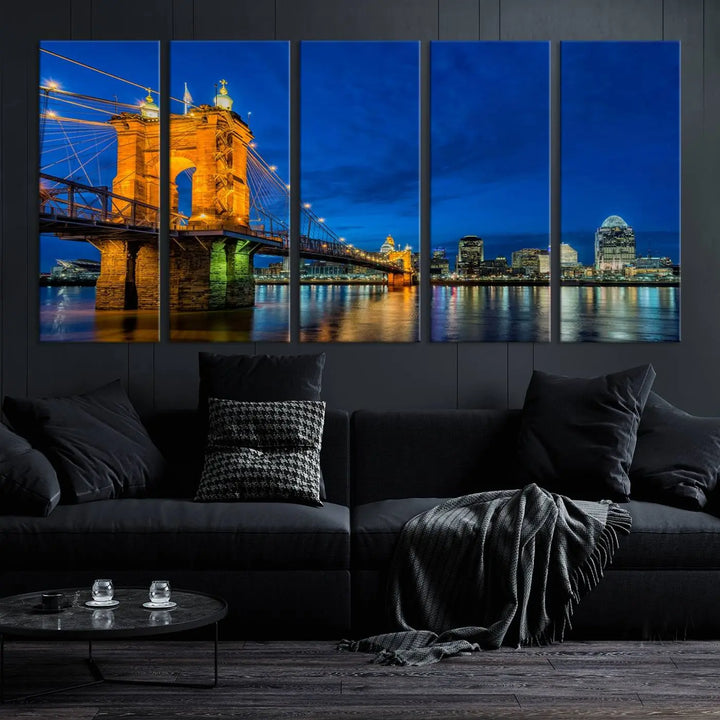 The living room features a museum-quality, multi-panel wall art titled "Cincinnati City Bridge Lights Night Skyline Cityscape View Wall Art Canvas Print," which depicts a lit-up bridge at night. The gallery-wrapped canvas adds a touch of elegance to the space.