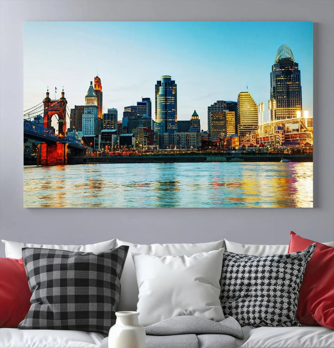 The "Cincinnati City Lights Bright Blue Skyline Cityscape View Wall Art Canvas Print" is a stunning triptych crafted on museum-quality canvas with a UV-protective coating to maintain its vivid colors. Ready to hang, it effortlessly elevates any space with its timeless allure.