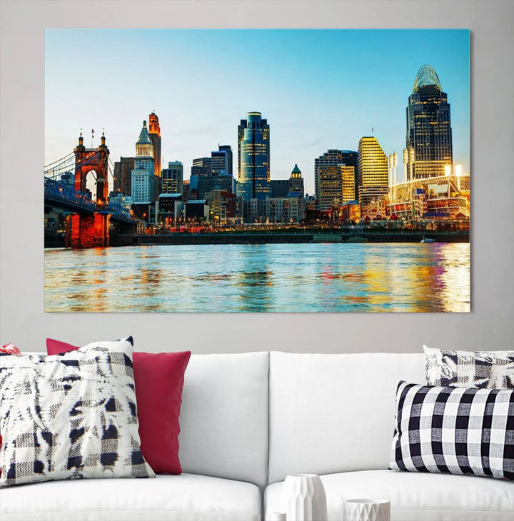 The "Cincinnati City Lights Bright Blue Skyline Cityscape View Wall Art Canvas Print" is a stunning triptych crafted on museum-quality canvas with a UV-protective coating to maintain its vivid colors. Ready to hang, it effortlessly elevates any space with its timeless allure.