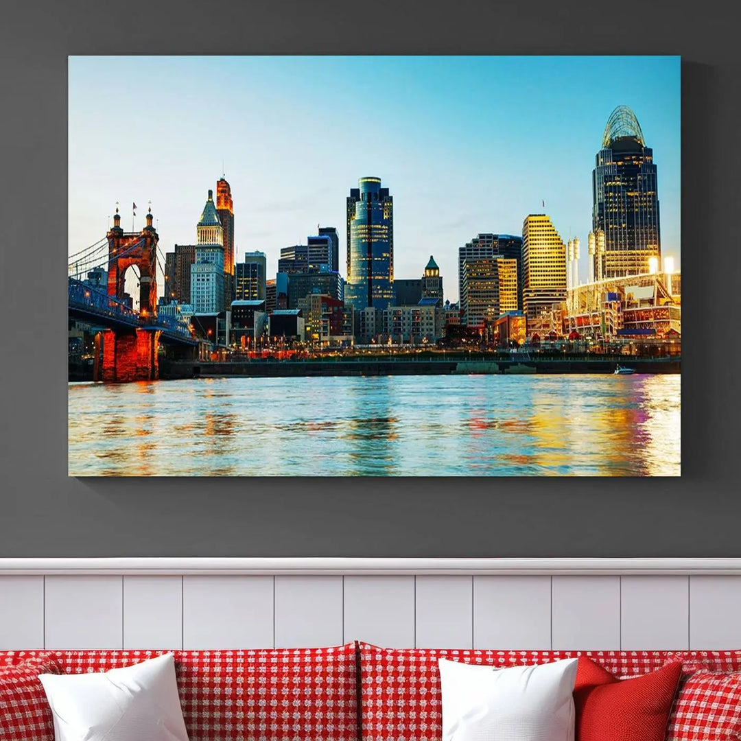 The "Cincinnati City Lights Bright Blue Skyline Cityscape View Wall Art Canvas Print" is a stunning triptych crafted on museum-quality canvas with a UV-protective coating to maintain its vivid colors. Ready to hang, it effortlessly elevates any space with its timeless allure.