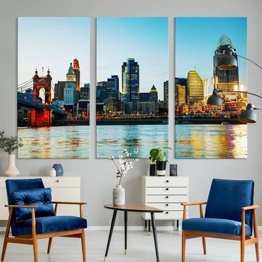 The "Cincinnati City Lights Bright Blue Skyline Cityscape View Wall Art Canvas Print" is a stunning triptych crafted on museum-quality canvas with a UV-protective coating to maintain its vivid colors. Ready to hang, it effortlessly elevates any space with its timeless allure.