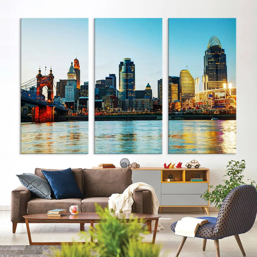 The "Cincinnati City Lights Bright Blue Skyline Cityscape View Wall Art Canvas Print" is a stunning triptych crafted on museum-quality canvas with a UV-protective coating to maintain its vivid colors. Ready to hang, it effortlessly elevates any space with its timeless allure.