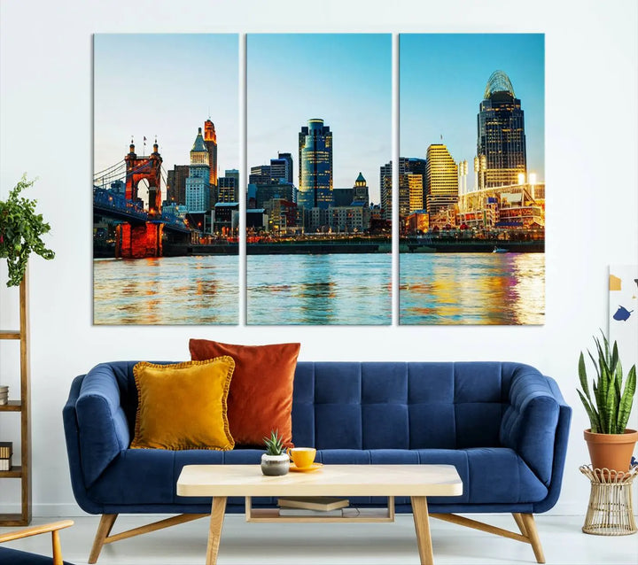 The "Cincinnati City Lights Bright Blue Skyline Cityscape View Wall Art Canvas Print" is a stunning triptych crafted on museum-quality canvas with a UV-protective coating to maintain its vivid colors. Ready to hang, it effortlessly elevates any space with its timeless allure.