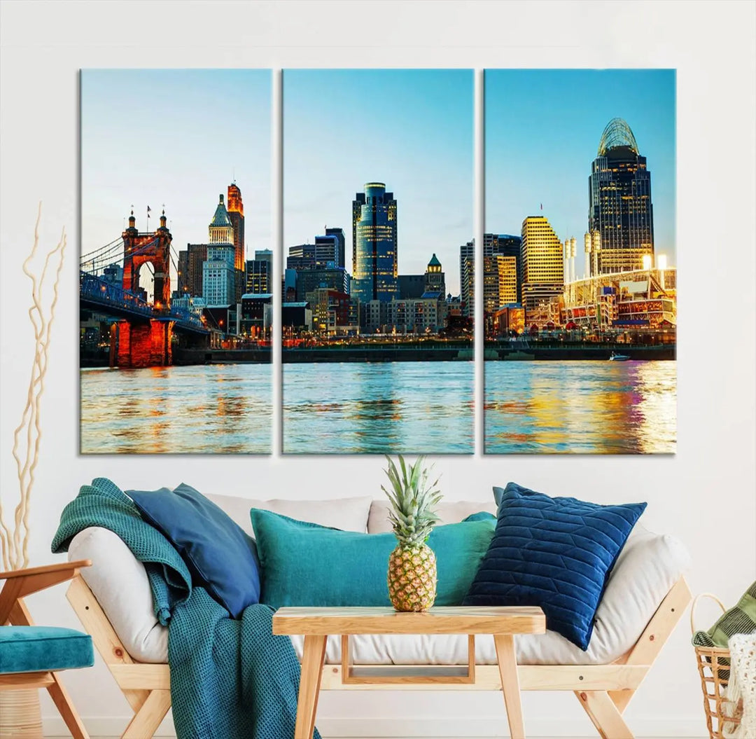 The "Cincinnati City Lights Bright Blue Skyline Cityscape View Wall Art Canvas Print" is a stunning triptych crafted on museum-quality canvas with a UV-protective coating to maintain its vivid colors. Ready to hang, it effortlessly elevates any space with its timeless allure.