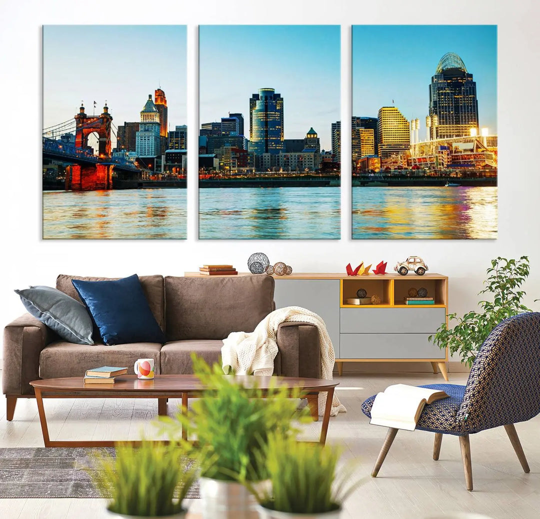 The "Cincinnati City Lights Bright Blue Skyline Cityscape View Wall Art Canvas Print" is a stunning triptych crafted on museum-quality canvas with a UV-protective coating to maintain its vivid colors. Ready to hang, it effortlessly elevates any space with its timeless allure.