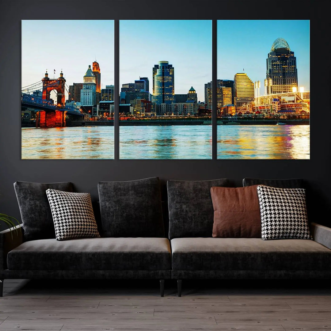 The "Cincinnati City Lights Bright Blue Skyline Cityscape View Wall Art Canvas Print" is a stunning triptych crafted on museum-quality canvas with a UV-protective coating to maintain its vivid colors. Ready to hang, it effortlessly elevates any space with its timeless allure.