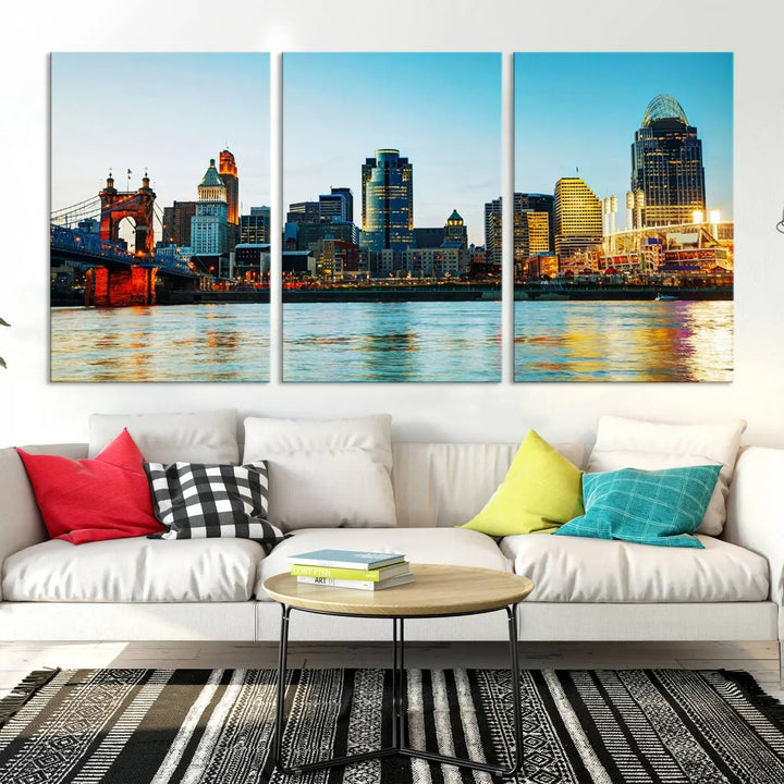 The "Cincinnati City Lights Bright Blue Skyline Cityscape View Wall Art Canvas Print" is a stunning triptych crafted on museum-quality canvas with a UV-protective coating to maintain its vivid colors. Ready to hang, it effortlessly elevates any space with its timeless allure.