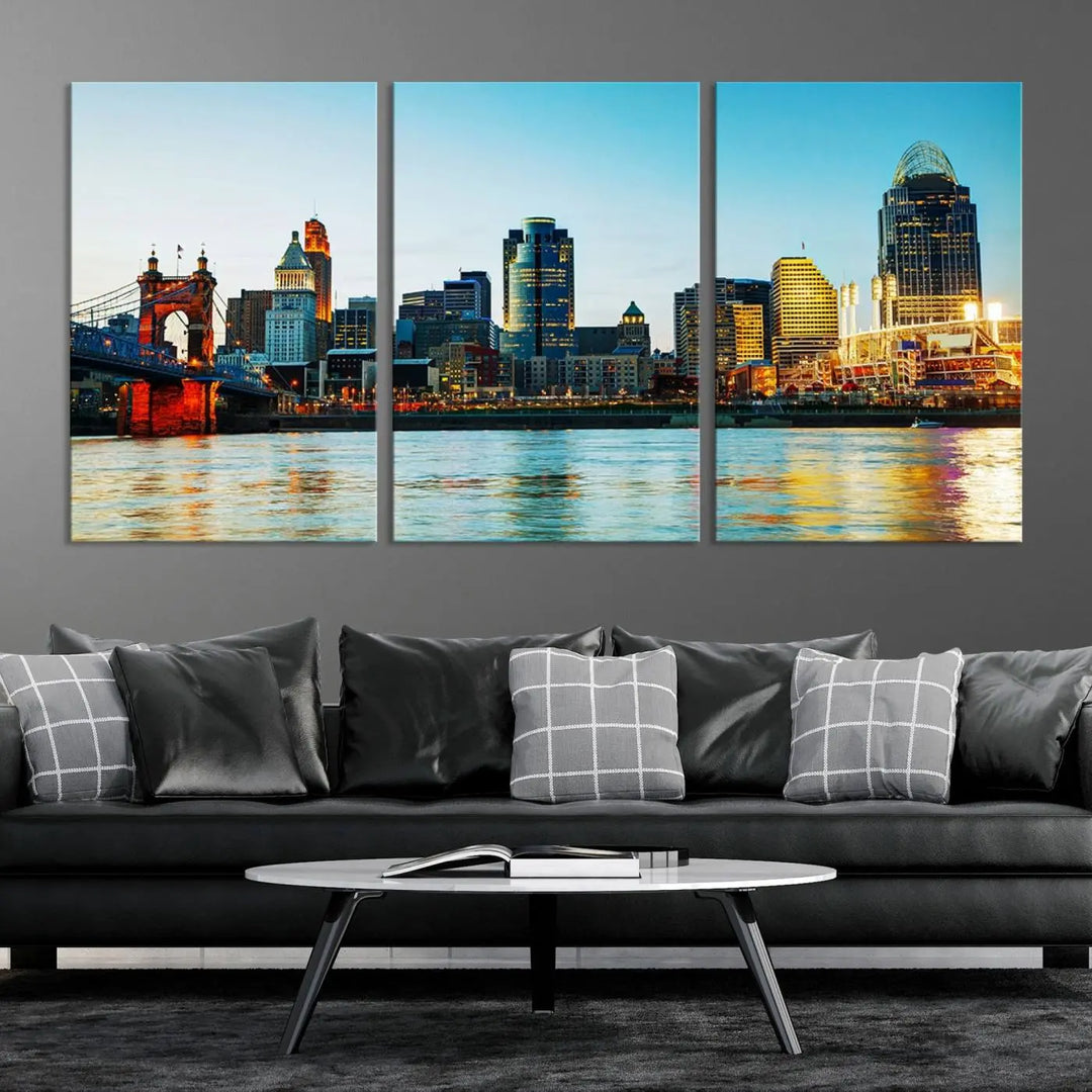 The "Cincinnati City Lights Bright Blue Skyline Cityscape View Wall Art Canvas Print" is a stunning triptych crafted on museum-quality canvas with a UV-protective coating to maintain its vivid colors. Ready to hang, it effortlessly elevates any space with its timeless allure.