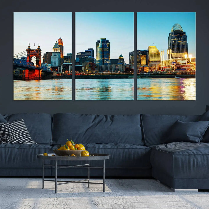 The "Cincinnati City Lights Bright Blue Skyline Cityscape View Wall Art Canvas Print" is a stunning triptych crafted on museum-quality canvas with a UV-protective coating to maintain its vivid colors. Ready to hang, it effortlessly elevates any space with its timeless allure.