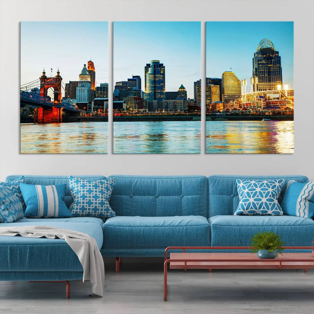 The "Cincinnati City Lights Bright Blue Skyline Cityscape View Wall Art Canvas Print" is a stunning triptych crafted on museum-quality canvas with a UV-protective coating to maintain its vivid colors. Ready to hang, it effortlessly elevates any space with its timeless allure.