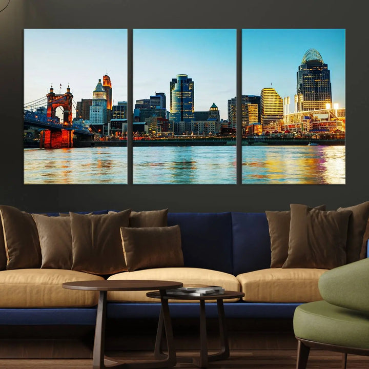 The "Cincinnati City Lights Bright Blue Skyline Cityscape View Wall Art Canvas Print" is a stunning triptych crafted on museum-quality canvas with a UV-protective coating to maintain its vivid colors. Ready to hang, it effortlessly elevates any space with its timeless allure.