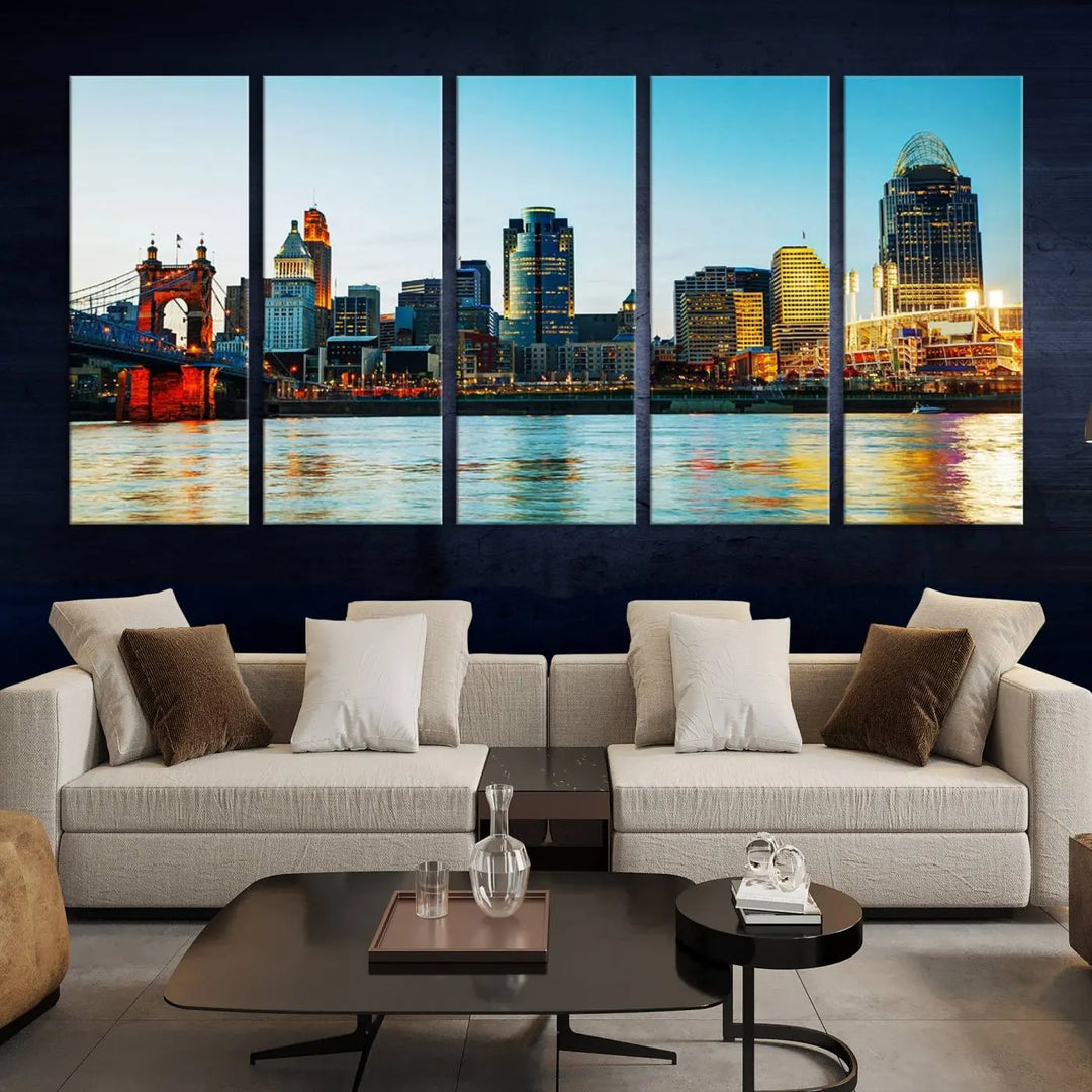 The "Cincinnati City Lights Bright Blue Skyline Cityscape View Wall Art Canvas Print" is a stunning triptych crafted on museum-quality canvas with a UV-protective coating to maintain its vivid colors. Ready to hang, it effortlessly elevates any space with its timeless allure.