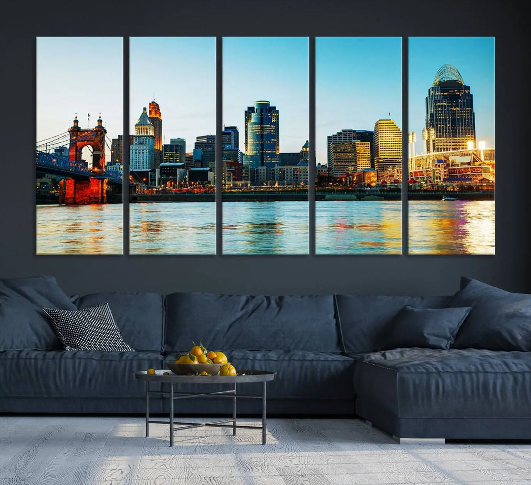 The "Cincinnati City Lights Bright Blue Skyline Cityscape View Wall Art Canvas Print" is a stunning triptych crafted on museum-quality canvas with a UV-protective coating to maintain its vivid colors. Ready to hang, it effortlessly elevates any space with its timeless allure.