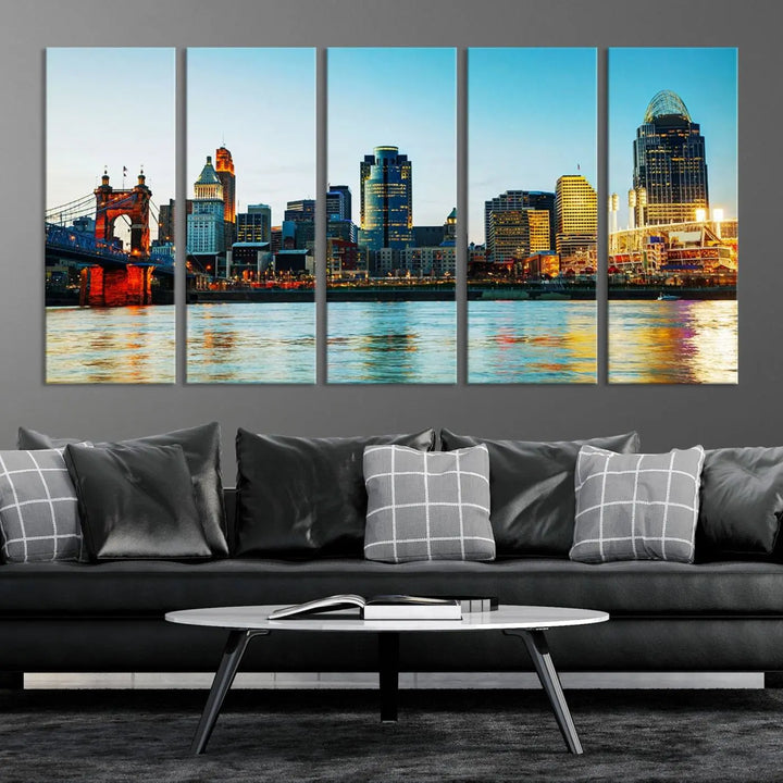 The "Cincinnati City Lights Bright Blue Skyline Cityscape View Wall Art Canvas Print" is a stunning triptych crafted on museum-quality canvas with a UV-protective coating to maintain its vivid colors. Ready to hang, it effortlessly elevates any space with its timeless allure.