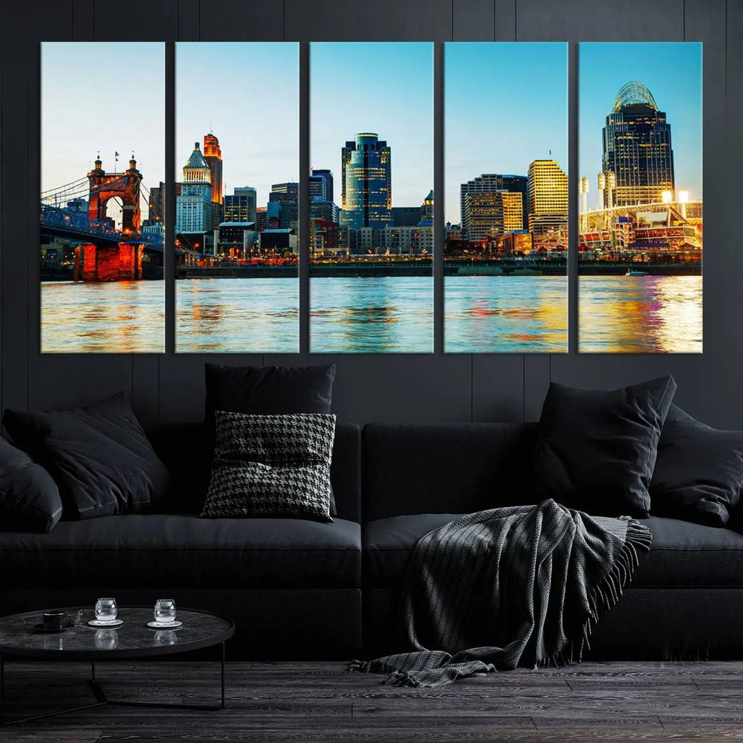 The "Cincinnati City Lights Bright Blue Skyline Cityscape View Wall Art Canvas Print" is a stunning triptych crafted on museum-quality canvas with a UV-protective coating to maintain its vivid colors. Ready to hang, it effortlessly elevates any space with its timeless allure.