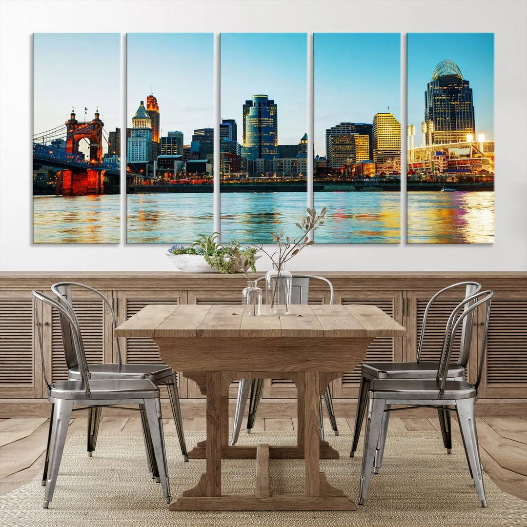 The "Cincinnati City Lights Bright Blue Skyline Cityscape View Wall Art Canvas Print" is a stunning triptych crafted on museum-quality canvas with a UV-protective coating to maintain its vivid colors. Ready to hang, it effortlessly elevates any space with its timeless allure.