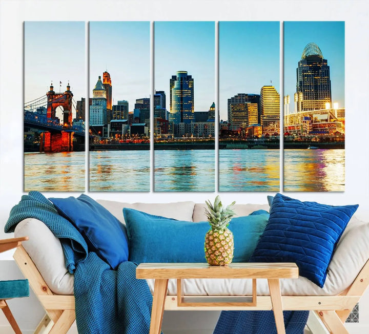 The "Cincinnati City Lights Bright Blue Skyline Cityscape View Wall Art Canvas Print" is a stunning triptych crafted on museum-quality canvas with a UV-protective coating to maintain its vivid colors. Ready to hang, it effortlessly elevates any space with its timeless allure.