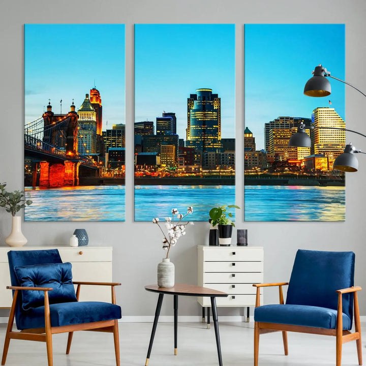 The "Cincinnati City Lights Bright Blue Skyline Cityscape View Wall Art Canvas Print" is displayed as a three-panel masterpiece. Expertly crafted on museum-quality polycotton canvas with a UV-protective coating, this artwork captures the essence of the city at dusk.