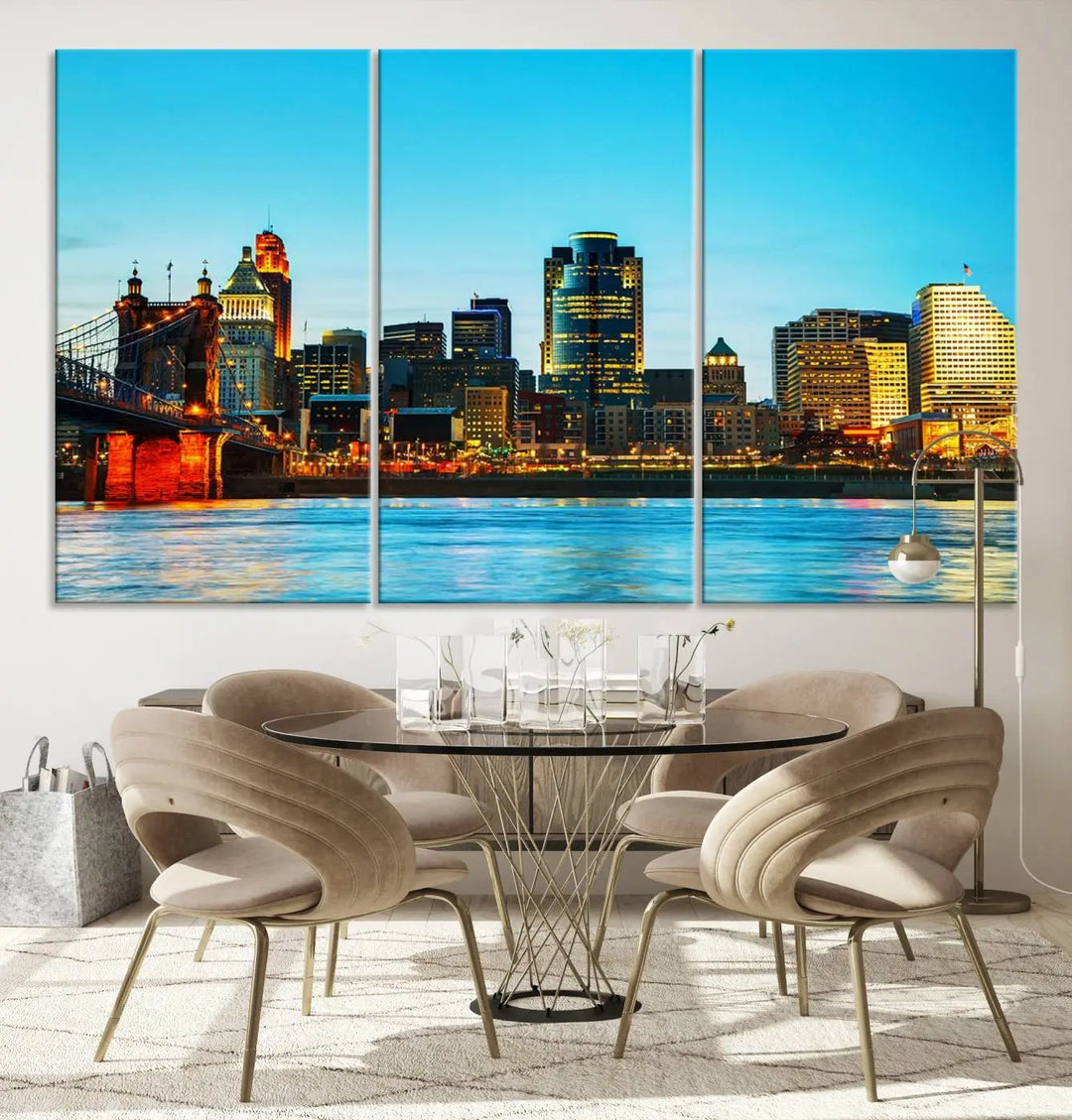 The "Cincinnati City Lights Bright Blue Skyline Cityscape View Wall Art Canvas Print" is displayed as a three-panel masterpiece. Expertly crafted on museum-quality polycotton canvas with a UV-protective coating, this artwork captures the essence of the city at dusk.