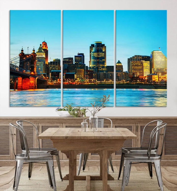 The "Cincinnati City Lights Bright Blue Skyline Cityscape View Wall Art Canvas Print" is displayed as a three-panel masterpiece. Expertly crafted on museum-quality polycotton canvas with a UV-protective coating, this artwork captures the essence of the city at dusk.