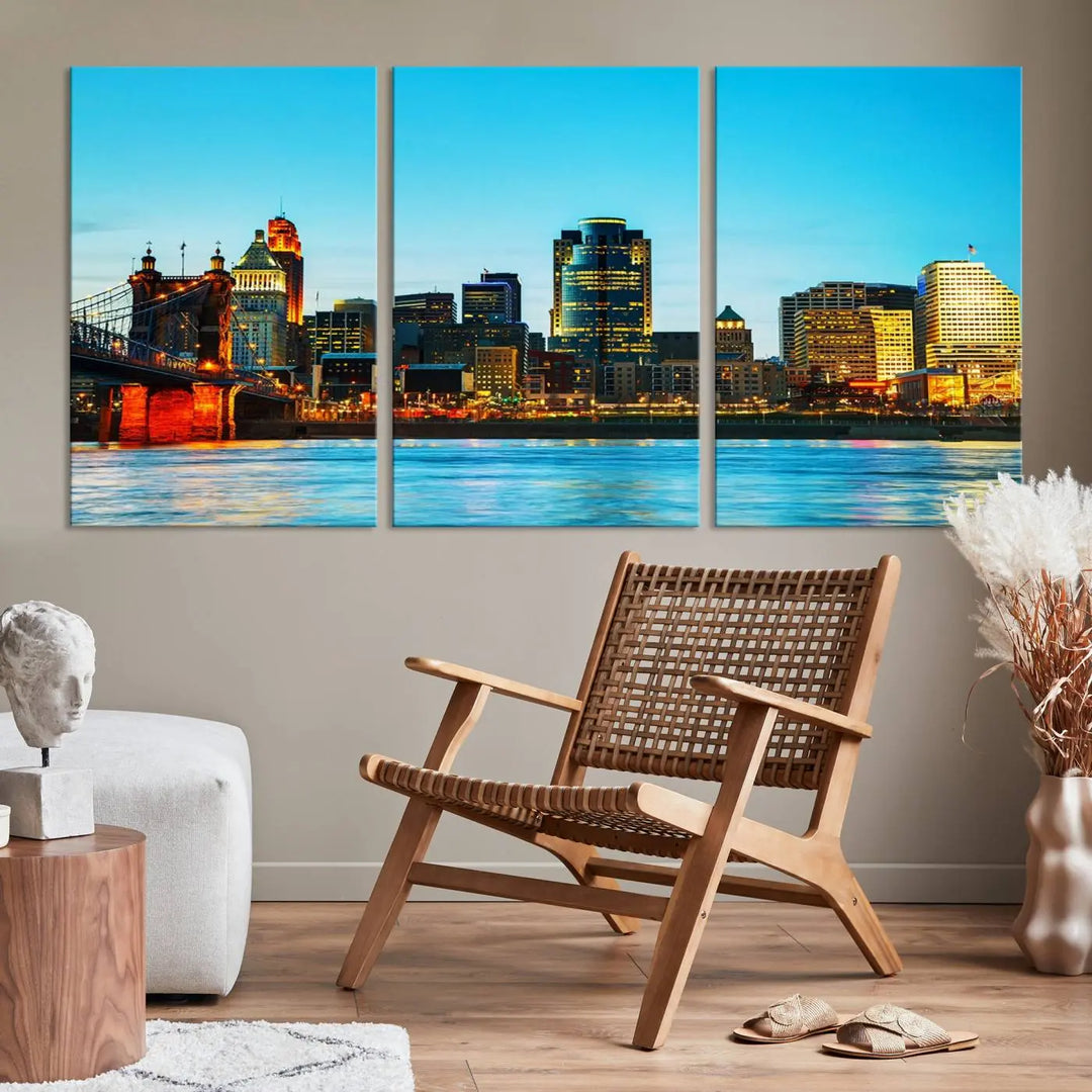 The "Cincinnati City Lights Bright Blue Skyline Cityscape View Wall Art Canvas Print" is displayed as a three-panel masterpiece. Expertly crafted on museum-quality polycotton canvas with a UV-protective coating, this artwork captures the essence of the city at dusk.