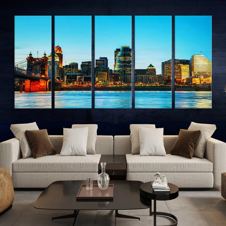 The "Cincinnati City Lights Bright Blue Skyline Cityscape View Wall Art Canvas Print" is displayed as a three-panel masterpiece. Expertly crafted on museum-quality polycotton canvas with a UV-protective coating, this artwork captures the essence of the city at dusk.