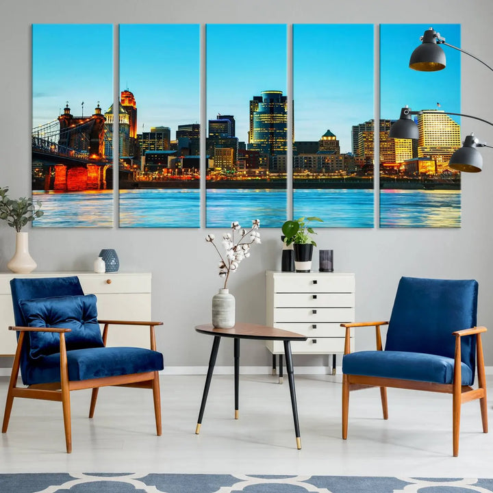 The "Cincinnati City Lights Bright Blue Skyline Cityscape View Wall Art Canvas Print" is displayed as a three-panel masterpiece. Expertly crafted on museum-quality polycotton canvas with a UV-protective coating, this artwork captures the essence of the city at dusk.