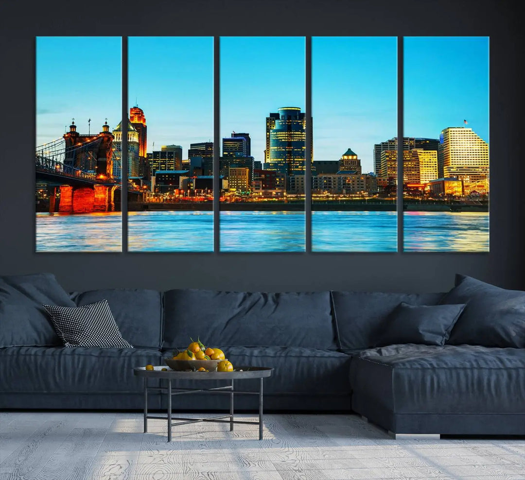 The "Cincinnati City Lights Bright Blue Skyline Cityscape View Wall Art Canvas Print" is displayed as a three-panel masterpiece. Expertly crafted on museum-quality polycotton canvas with a UV-protective coating, this artwork captures the essence of the city at dusk.