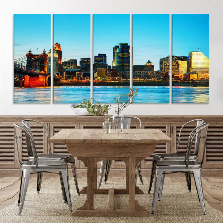 The "Cincinnati City Lights Bright Blue Skyline Cityscape View Wall Art Canvas Print" is displayed as a three-panel masterpiece. Expertly crafted on museum-quality polycotton canvas with a UV-protective coating, this artwork captures the essence of the city at dusk.