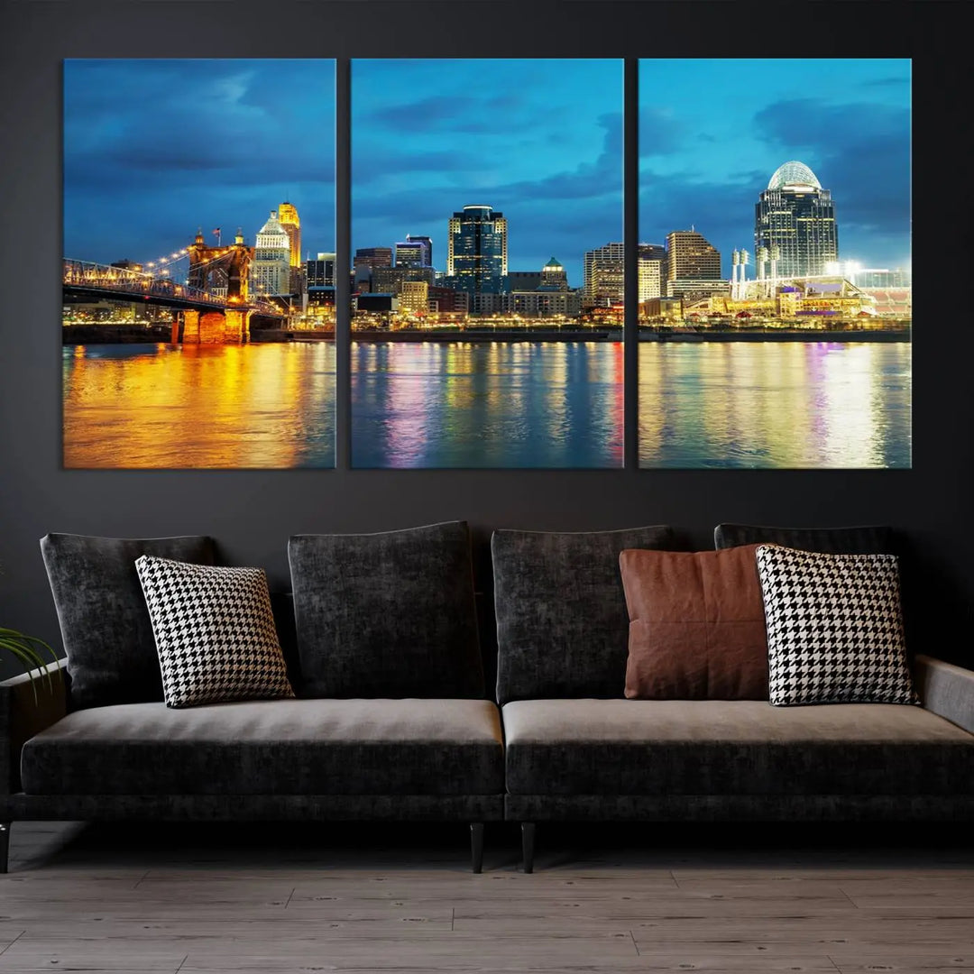 Displayed on a museum-quality canvas, the "Cincinnati City Lights Night Blue Skyline Cityscape View Wall Art Canvas Print" captures the city skyline's reflection in water at night.