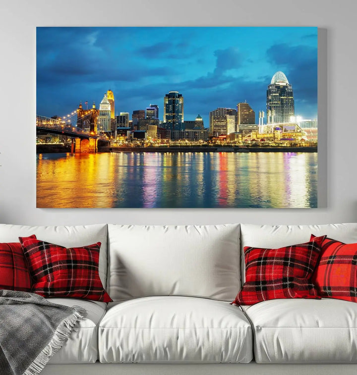 Displayed on a museum-quality canvas, the "Cincinnati City Lights Night Blue Skyline Cityscape View Wall Art Canvas Print" captures the city skyline's reflection in water at night.