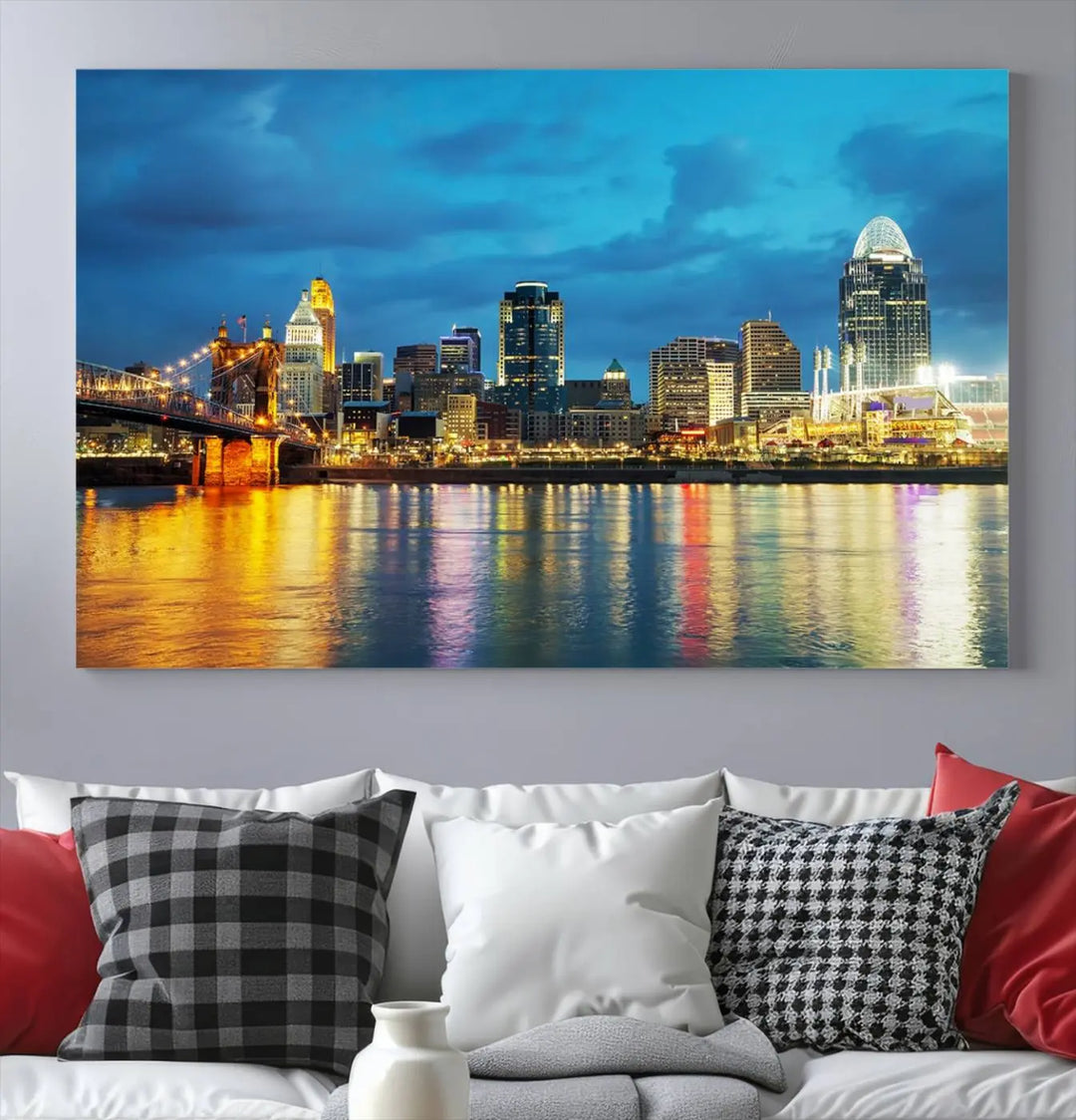 Displayed on a museum-quality canvas, the "Cincinnati City Lights Night Blue Skyline Cityscape View Wall Art Canvas Print" captures the city skyline's reflection in water at night.