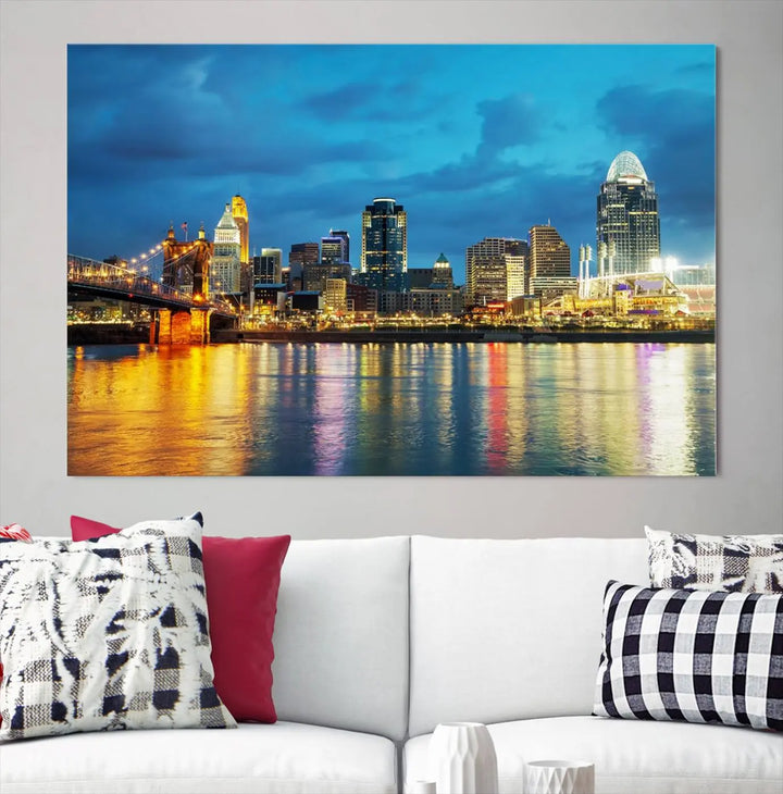 Displayed on a museum-quality canvas, the "Cincinnati City Lights Night Blue Skyline Cityscape View Wall Art Canvas Print" captures the city skyline's reflection in water at night.