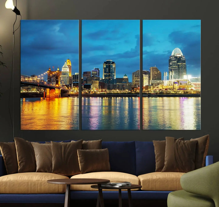 Displayed on a museum-quality canvas, the "Cincinnati City Lights Night Blue Skyline Cityscape View Wall Art Canvas Print" captures the city skyline's reflection in water at night.