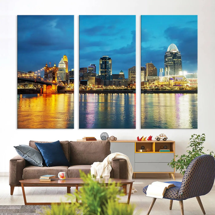 Displayed on a museum-quality canvas, the "Cincinnati City Lights Night Blue Skyline Cityscape View Wall Art Canvas Print" captures the city skyline's reflection in water at night.