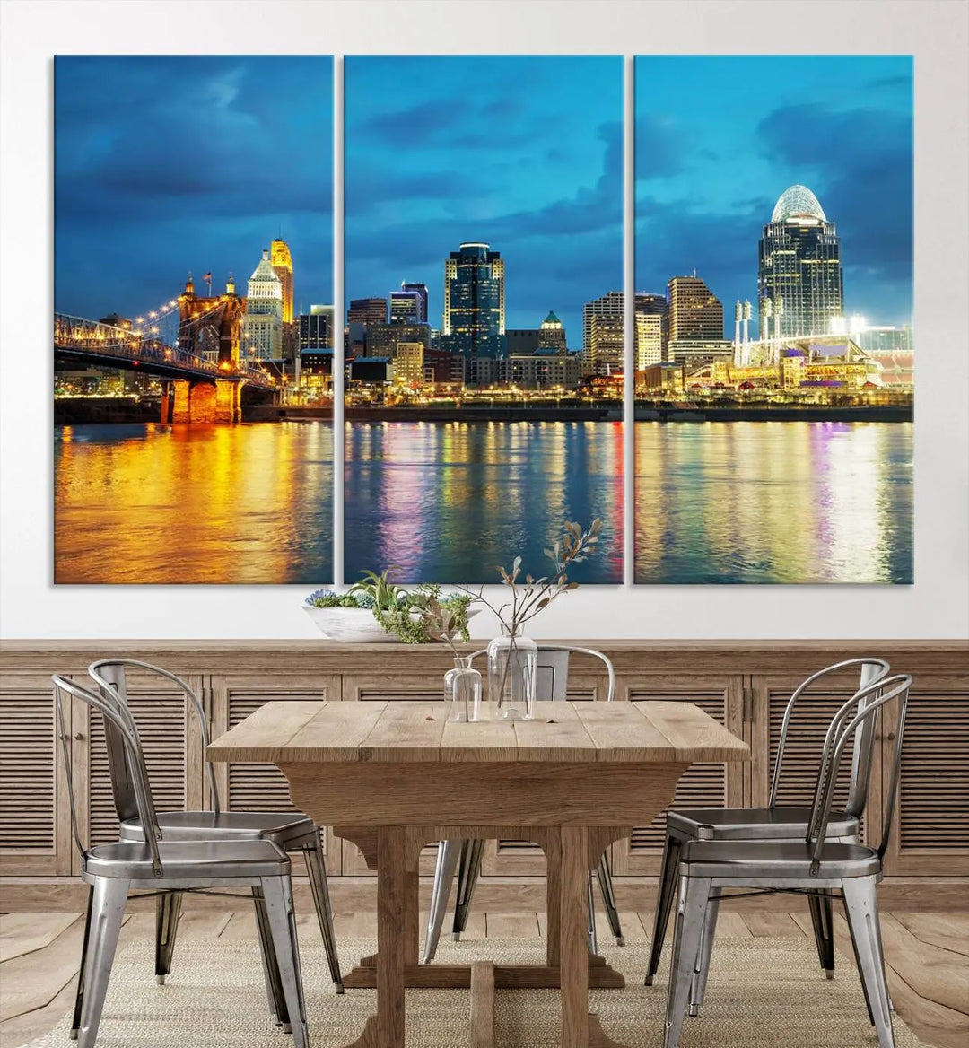 Displayed on a museum-quality canvas, the "Cincinnati City Lights Night Blue Skyline Cityscape View Wall Art Canvas Print" captures the city skyline's reflection in water at night.