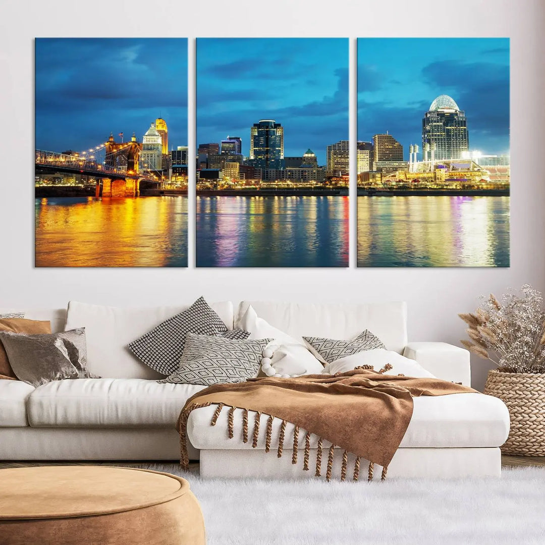 Displayed on a museum-quality canvas, the "Cincinnati City Lights Night Blue Skyline Cityscape View Wall Art Canvas Print" captures the city skyline's reflection in water at night.