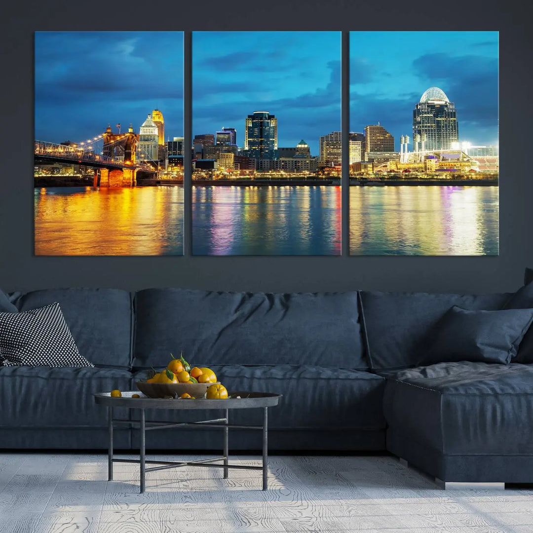 Displayed on a museum-quality canvas, the "Cincinnati City Lights Night Blue Skyline Cityscape View Wall Art Canvas Print" captures the city skyline's reflection in water at night.