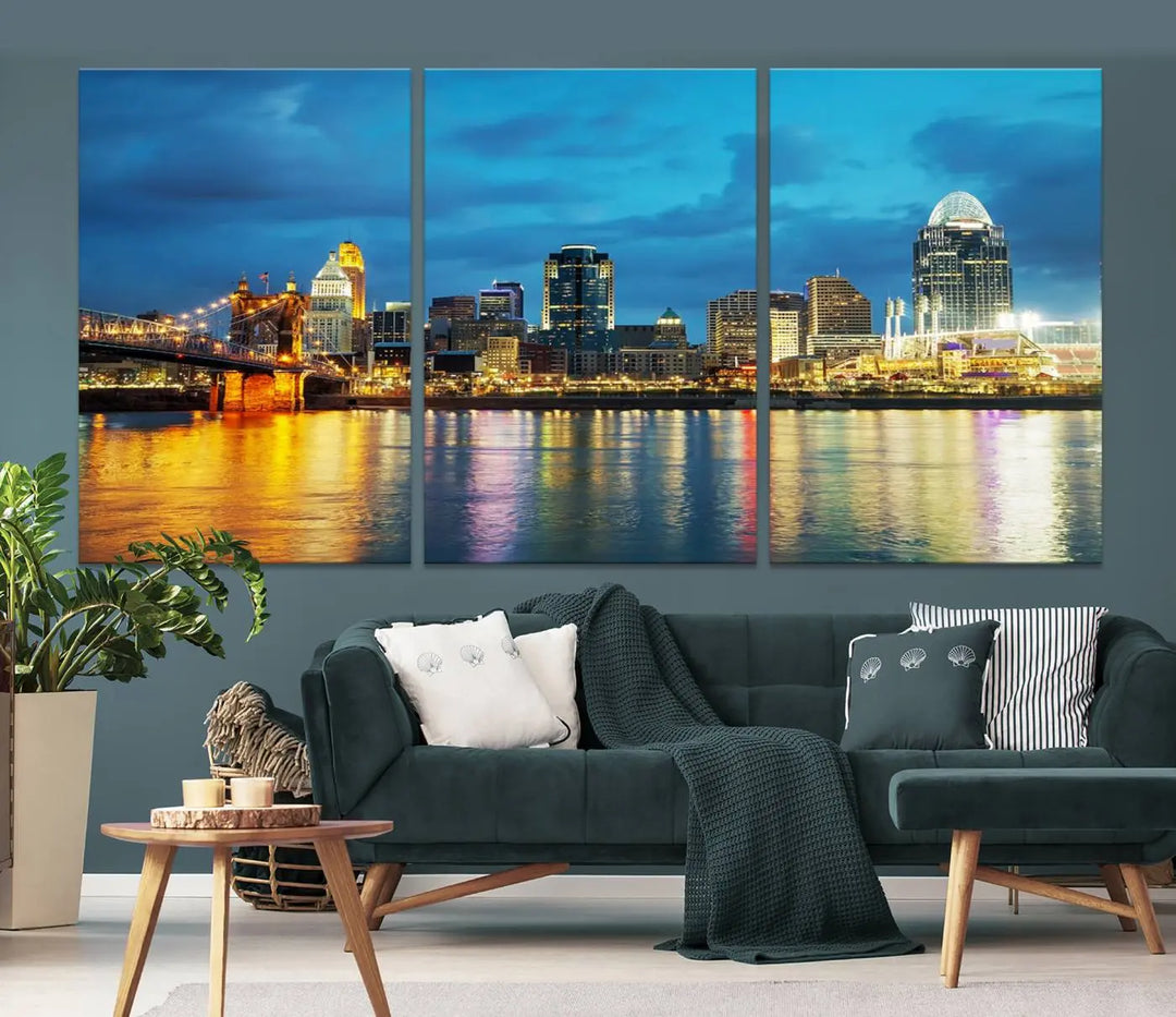 Displayed on a museum-quality canvas, the "Cincinnati City Lights Night Blue Skyline Cityscape View Wall Art Canvas Print" captures the city skyline's reflection in water at night.