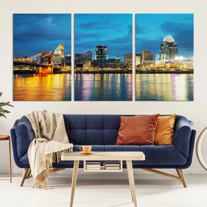 Displayed on a museum-quality canvas, the "Cincinnati City Lights Night Blue Skyline Cityscape View Wall Art Canvas Print" captures the city skyline's reflection in water at night.