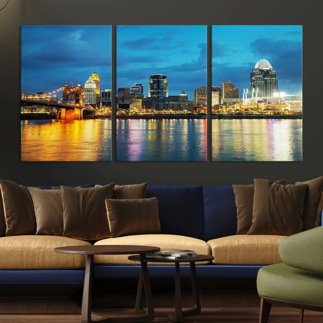 Displayed on a museum-quality canvas, the "Cincinnati City Lights Night Blue Skyline Cityscape View Wall Art Canvas Print" captures the city skyline's reflection in water at night.