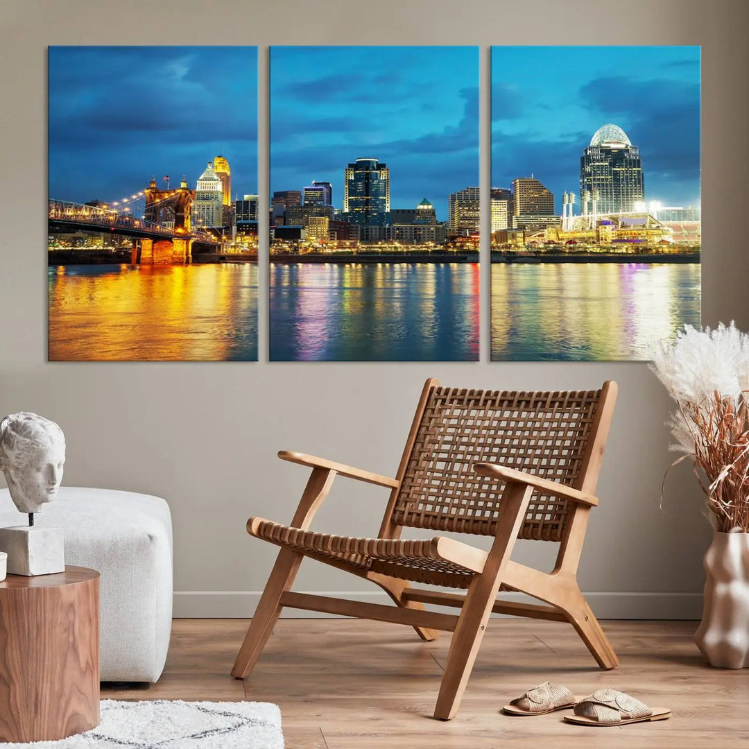 Displayed on a museum-quality canvas, the "Cincinnati City Lights Night Blue Skyline Cityscape View Wall Art Canvas Print" captures the city skyline's reflection in water at night.