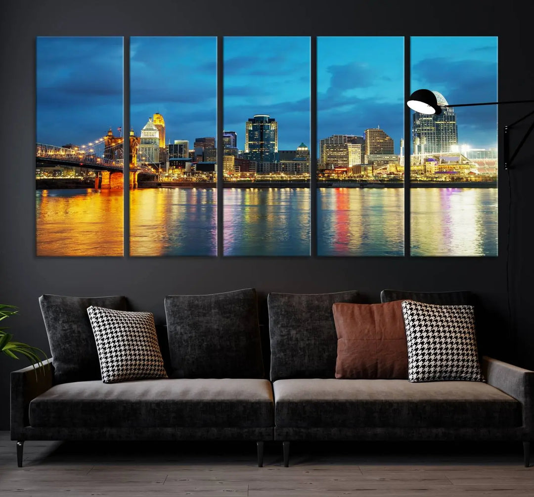 Displayed on a museum-quality canvas, the "Cincinnati City Lights Night Blue Skyline Cityscape View Wall Art Canvas Print" captures the city skyline's reflection in water at night.