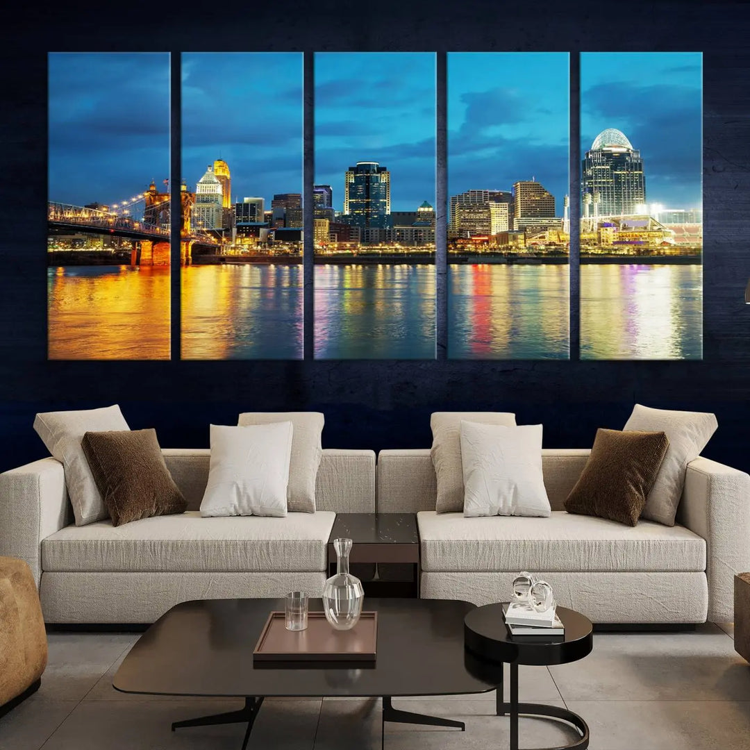 Displayed on a museum-quality canvas, the "Cincinnati City Lights Night Blue Skyline Cityscape View Wall Art Canvas Print" captures the city skyline's reflection in water at night.