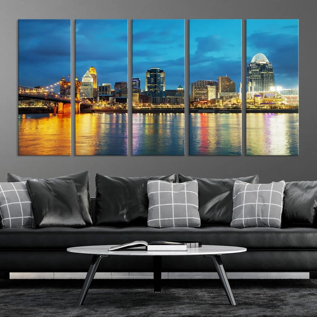 Displayed on a museum-quality canvas, the "Cincinnati City Lights Night Blue Skyline Cityscape View Wall Art Canvas Print" captures the city skyline's reflection in water at night.