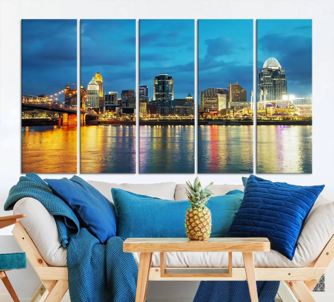 Displayed on a museum-quality canvas, the "Cincinnati City Lights Night Blue Skyline Cityscape View Wall Art Canvas Print" captures the city skyline's reflection in water at night.