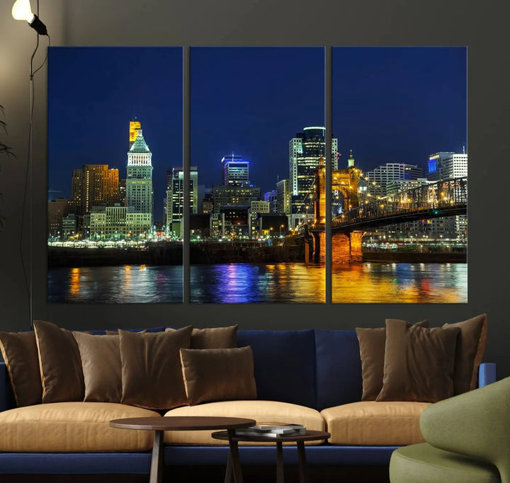 The "Cincinnati City Lights Night Skyline Cityscape" canvas print, displayed above a sofa, exhibits museum-quality craftsmanship with a UV-protective coating.