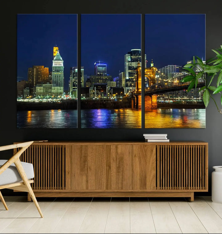 The "Cincinnati City Lights Night Skyline Cityscape" canvas print, displayed above a sofa, exhibits museum-quality craftsmanship with a UV-protective coating.